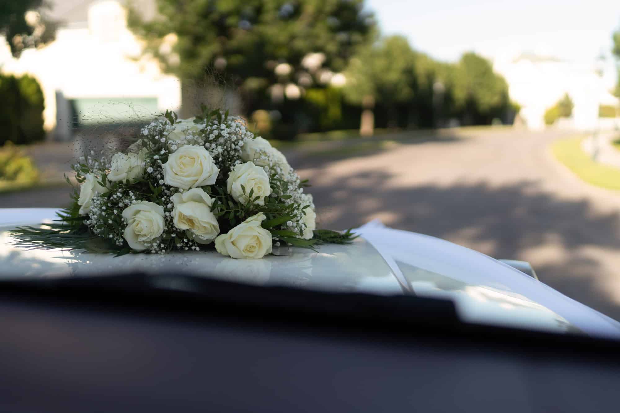 Bridal flower bouquet on the car
